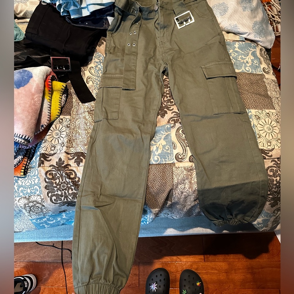 green cargo pants with pockets on side and belt